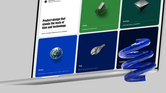 An open laptop on a light background with a decorative spring object