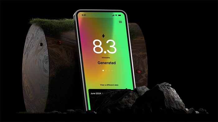 mobile device leaning against a wooden log