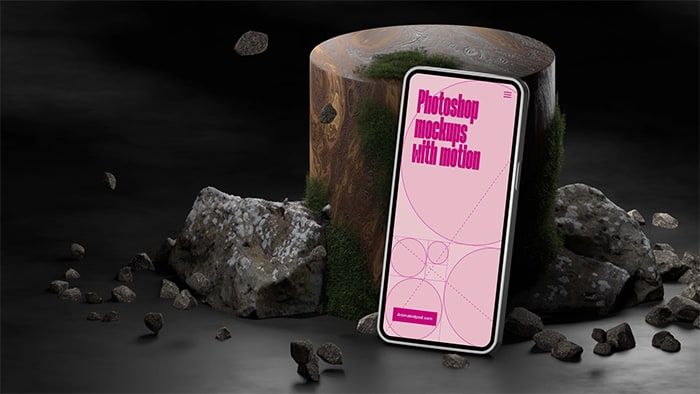 Mobile device leaning against an upright wooden log with rocks all around