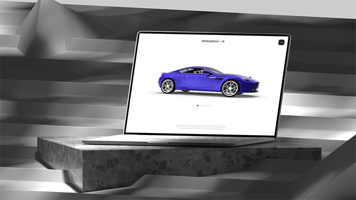 Open laptop sitting on terrazzo plinth and on steps with shadows cast all around