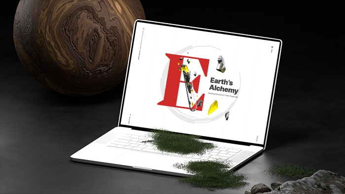 Laptop sitting on hard surface with  moss growing on it. A large wooden ball is in the background.