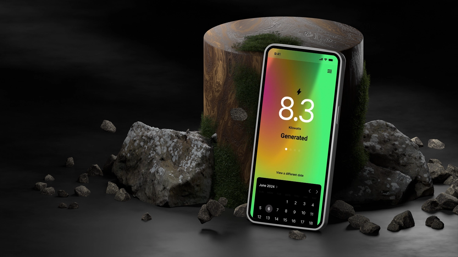 Mobile device leaning against an upright wooden log with rocks all around