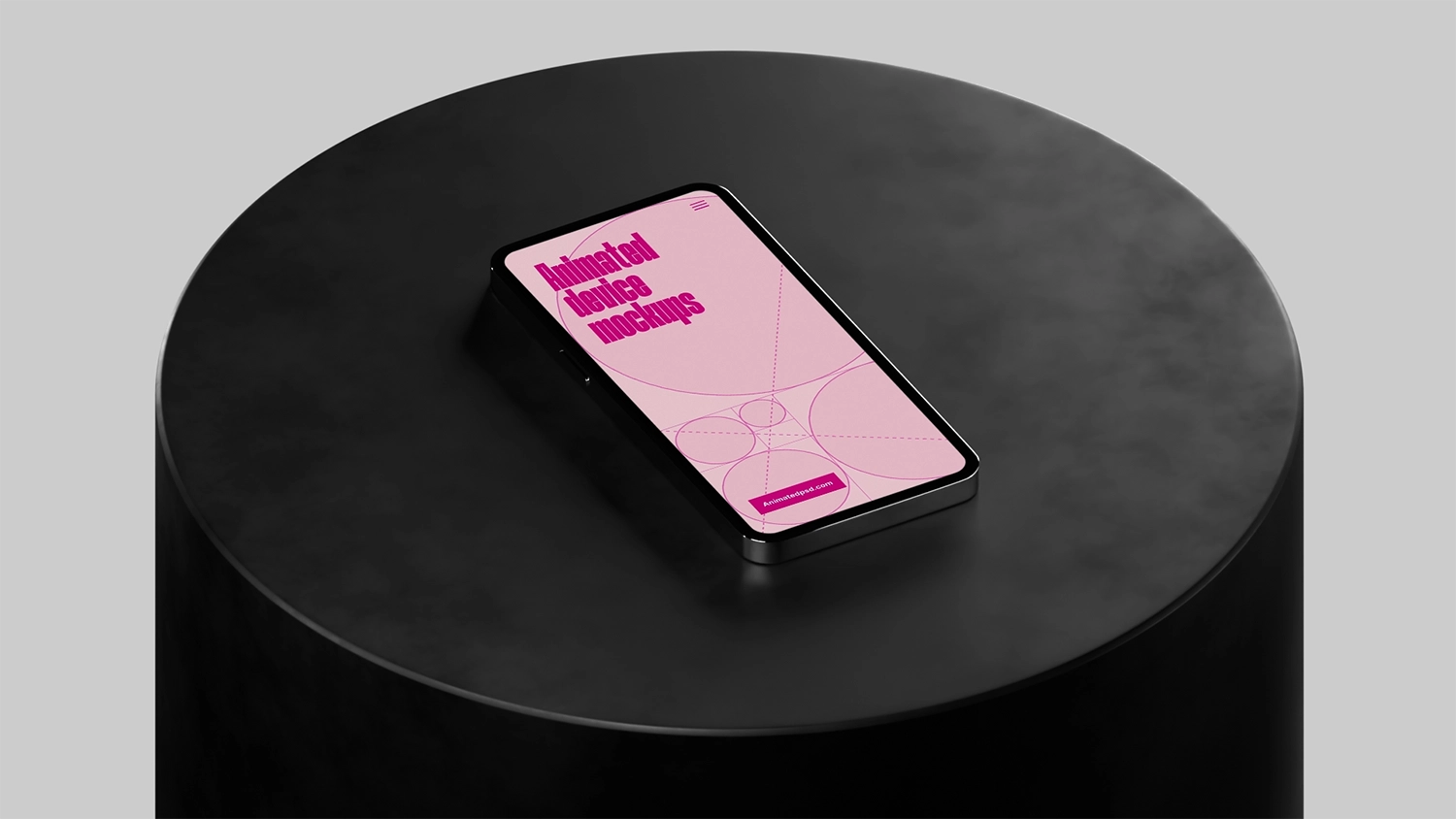 A mobile device sitting on cylindrical black plinth with a light background