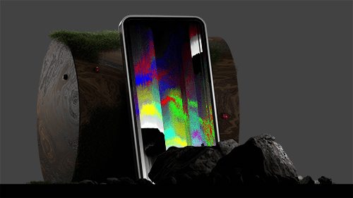 A mobile device leaning against a wooden log with a dark background